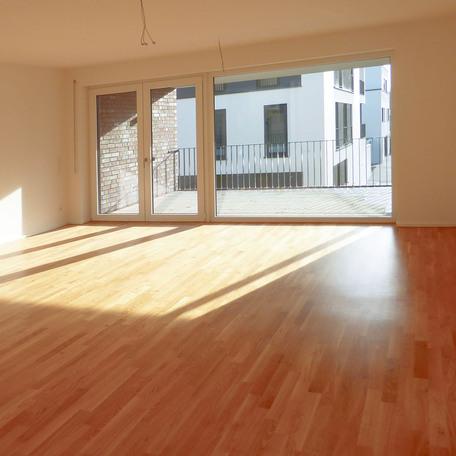 Wohnzimmer mit Balkon des Modern Green Bauprojekts am Efing in Bocholt