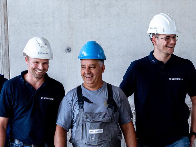 schmeing_maurer_bauleiter_mitarbeitenden_team_baustelle